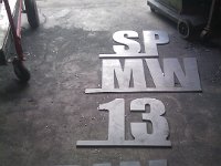 IMAGE 337  Large 1/4" plate letters cut out for identification for a local farm operation.  These were cut on the old CNC table.